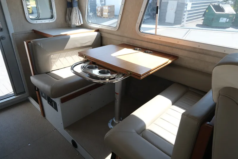 Slide: The Image of Interior of 2022 KingFisher 3425 GFX Offshore boat with seating and table. - 14