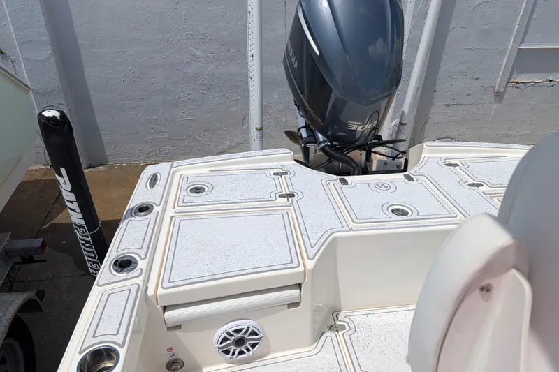 Slide: The Image of 2021 Pathfinder 2500 Hybrid boat deck with Yamaha 300 engine, featuring rod holders and speaker. - 15