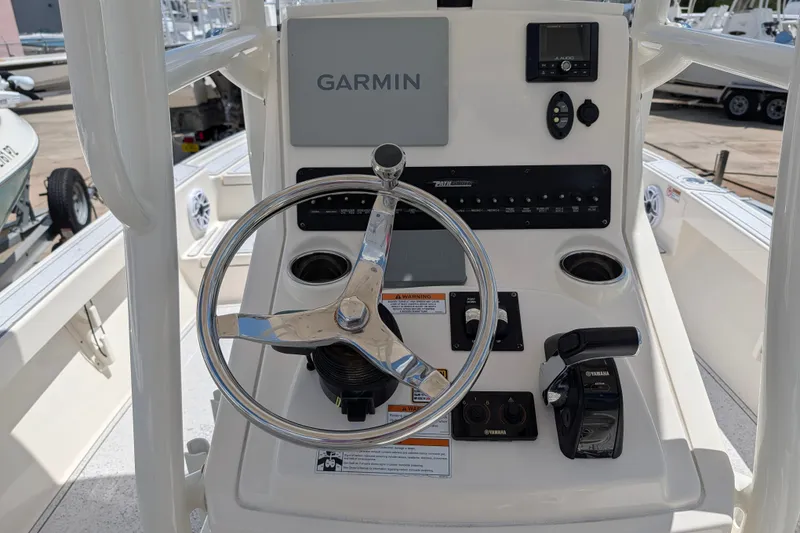 Slide: The Image of 2021 Pathfinder 2500 Hybrid boat console with Garmin navigation and Yamaha controls. - 30