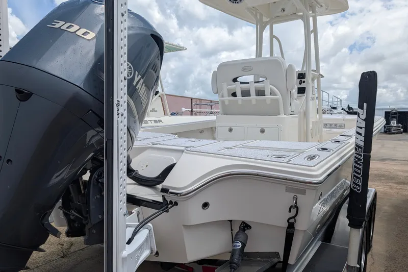 Slide: The Image of 2021 Pathfinder 2500 Hybrid boat with Yamaha 300 engine, docked under cloudy skies. - 10