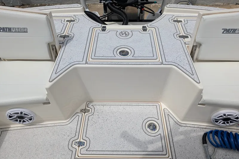 Slide: The Image of 2021 Pathfinder 2500 Hybrid boat deck with seating and storage compartments. - 53