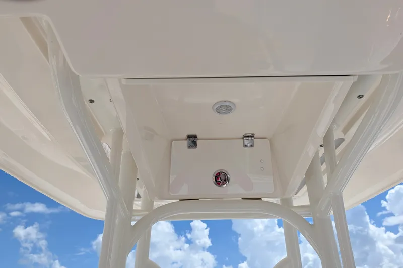 Slide: The Image of 2021 Pathfinder 2500 Hybrid boat interior with white finish against blue sky. - 32