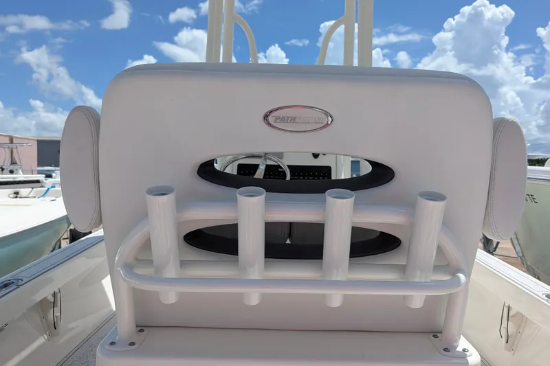 Slide: The Image of Pathfinder 2500 Hybrid 2021 boat seat with rod holders under a blue sky. - 25