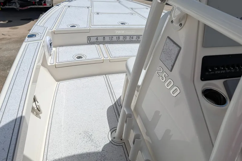 Slide: The Image of 2021 Pathfinder 2500 Hybrid boat deck with measurement markings and console details. - 35
