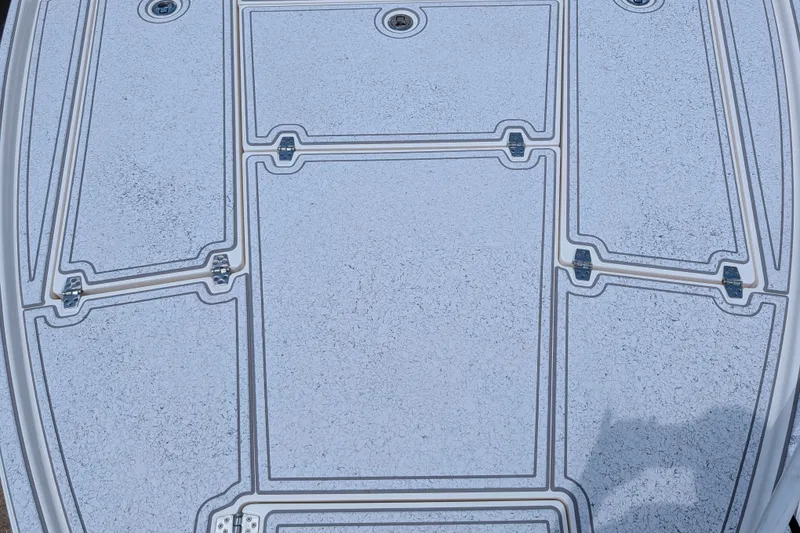 Slide: The Image of Deck of 2021 Pathfinder 2500 Hybrid boat with textured surface and hatch covers. - 41