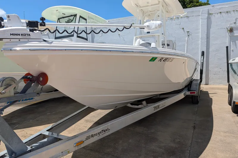 Slide: The Image of 2021 Pathfinder 2500 Hybrid boat on trailer, featuring Minn Kota trolling motor. - 4