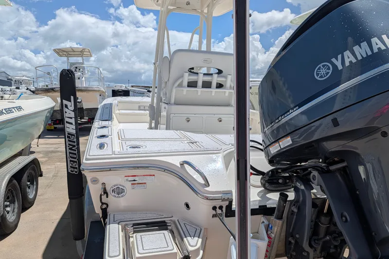 Slide: The Image of Pathfinder 2500 Hybrid boat with Yamaha engine, docked under a cloudy sky. - 11