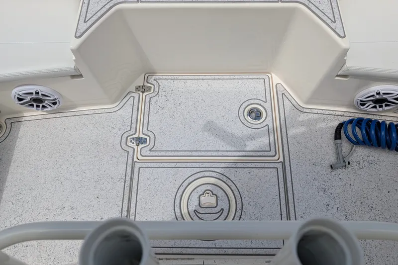 Slide: The Image of 2021 Pathfinder 2500 Hybrid boat deck with storage compartments and marine speakers. - 52
