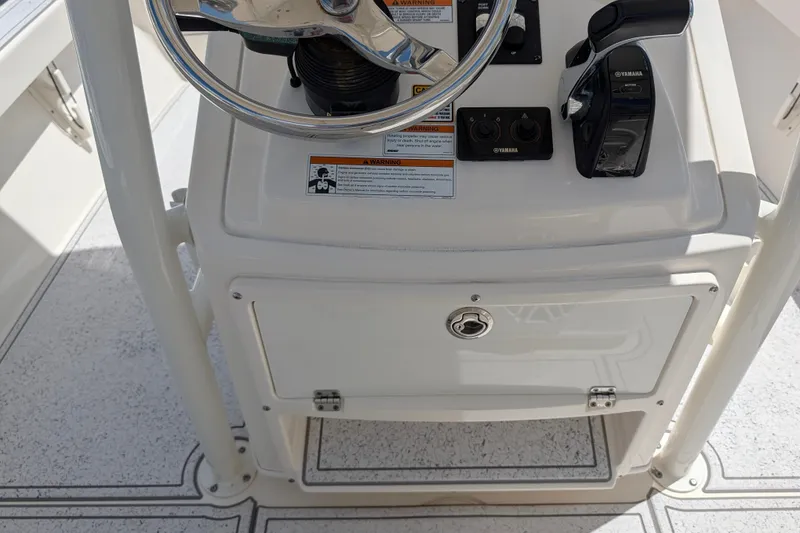 Slide: The Image of 2021 Pathfinder 2500 Hybrid boat console with steering wheel and Yamaha controls. - 29