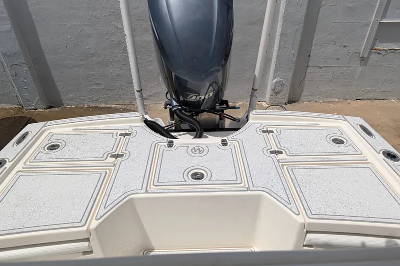 Slide: The Image of 2021 Pathfinder 2500 Hybrid boat with Yamaha outboard motor, featuring a spacious deck design. - 54