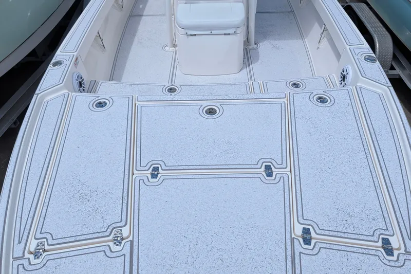 Slide: The Image of 2021 Pathfinder 2500 Hybrid boat deck with textured non-slip surface and storage compartments. - 42