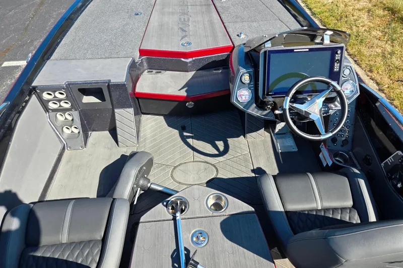 Slide: The Image of 2025 Vexus VX21 boat interior with modern dashboard, steering wheel, and seating. - 15