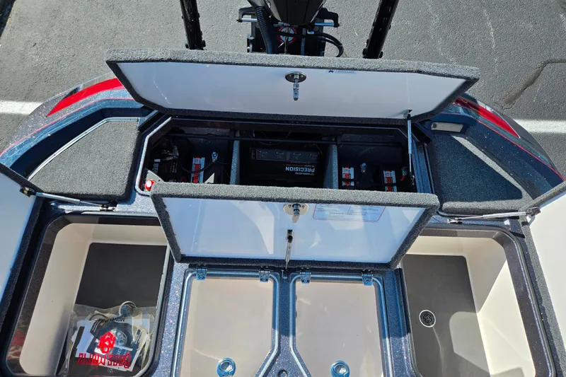 Slide: The Image of 2025 Vexus VX21 boat storage compartments with open lids, showcasing interior organization. - 27
