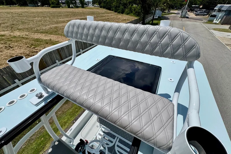 Slide: The Image of 2024 Shallow Sport 25 X3 boat with diamond-stitched seating and rod holders. - 19