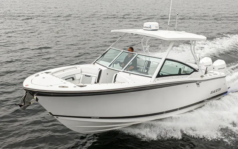 The Image of 2024 Blackfin 272 DC boat cruising on the water. - 0