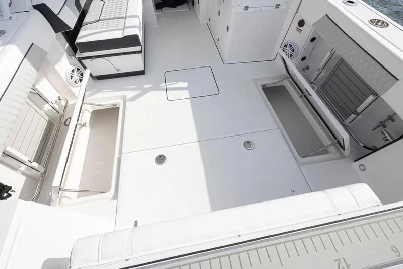 Slide: The Image of 2024 Blackfin 272 DC boat interior with storage compartments and seating. - 35