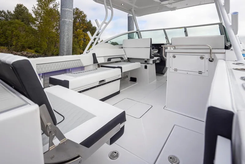 Slide: The Image of 2024 Blackfin 272 DC boat interior with white and black seating, modern design. - 13