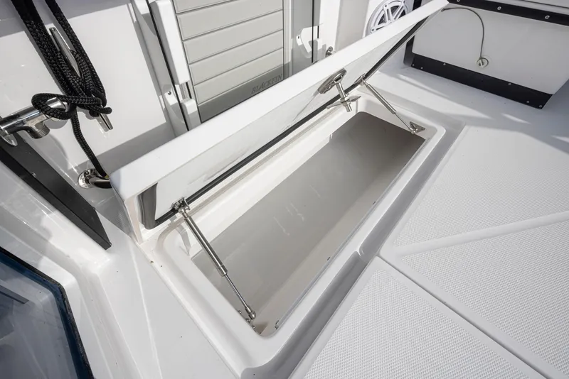 Slide: The Image of Open storage compartment on the 2024 Blackfin 272 DC boat. - 36