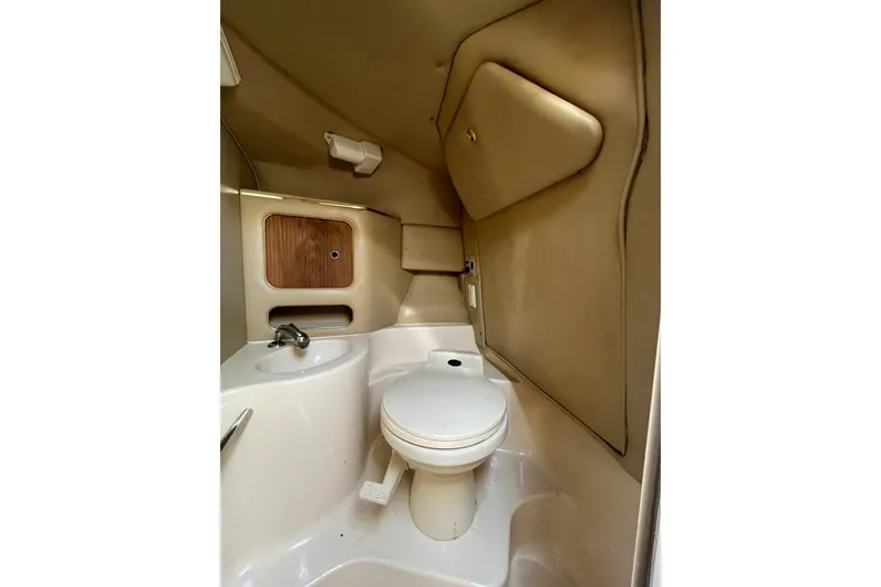 Slide: The Image of 1998 Sea Ray 280 Sun Sport boat bathroom with sink and toilet. - 17