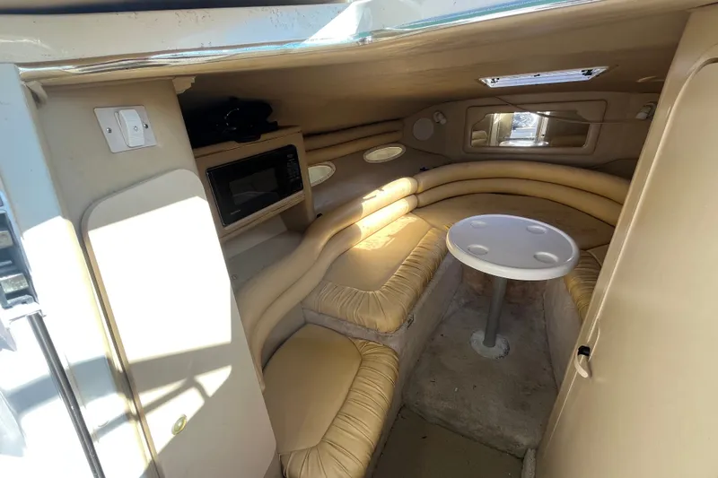 Slide: The Image of Interior of 1998 Sea Ray 280 Sun Sport boat with seating and table. - 20