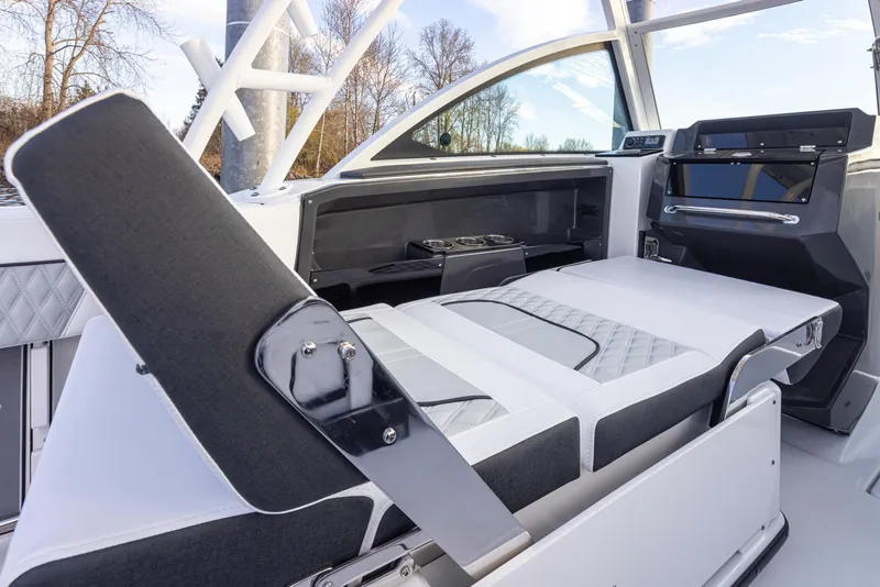 Slide: The Image of 2024 Blackfin 252 DC boat interior with adjustable seating and modern design. - 16