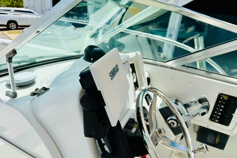 Slide: The Image of Helm of 2006 Glacier Bay 2670 Isle Runner with steering wheel and navigation equipment. - 31