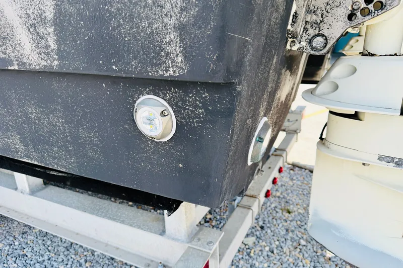 Slide: The Image of Close-up of a 2006 Glacier Bay 2670 Isle Runner boat hull with visible LED lights. - 33