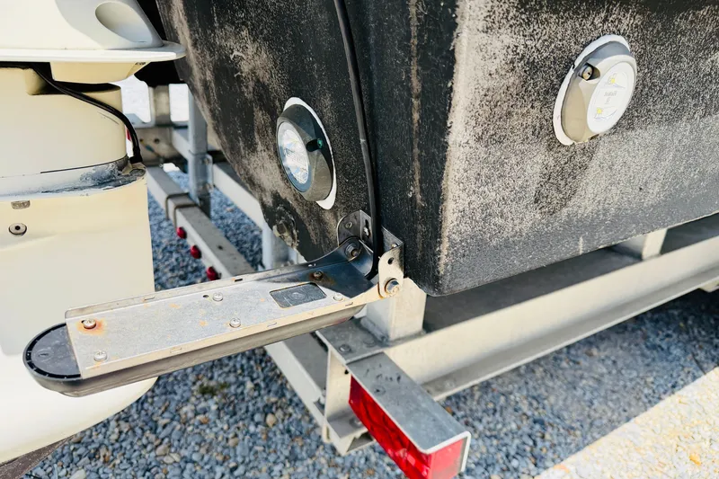 Slide: The Image of Close-up of a 2006 Glacier Bay 2670 Isle Runner boat's rear section on a trailer. - 34