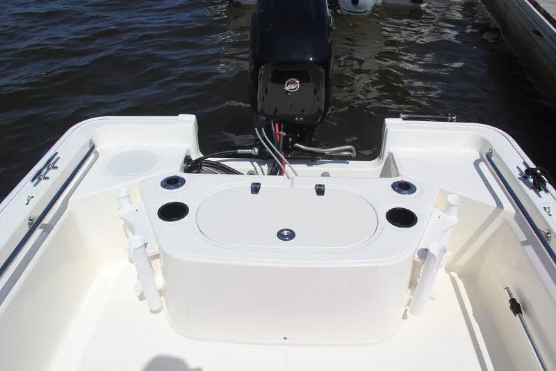 Slide: The Image of Manufacturer Provided Image: 2018 Boston Whaler 150 Montauk boat stern with motor and fishing rod holders. - 11