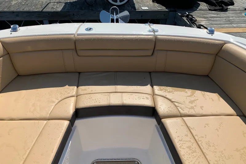 Slide: The Image of 2022 Sea Ray SDX 270 boat with wet tan leather seating at the bow. - 14