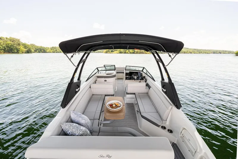 Slide: The Image of Manufacturer Provided Image: 2022 Sea Ray SDX 270 boat with spacious seating and canopy on a serene lake. - 25