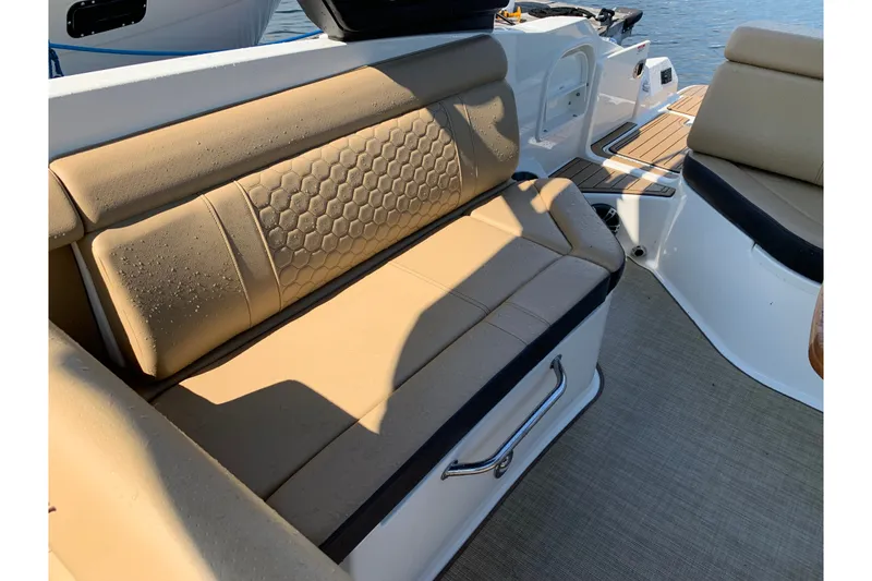 Slide: The Image of Luxurious seating on 2022 Sea Ray SDX 270 boat, featuring tan upholstery and modern design. - 20