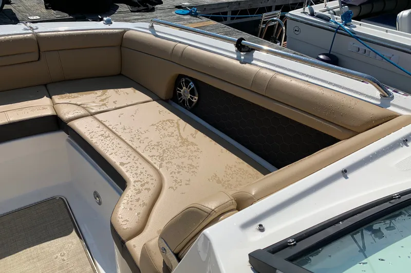 Slide: The Image of Luxurious seating on 2022 Sea Ray SDX 270 boat, featuring beige upholstery and sleek design. - 13