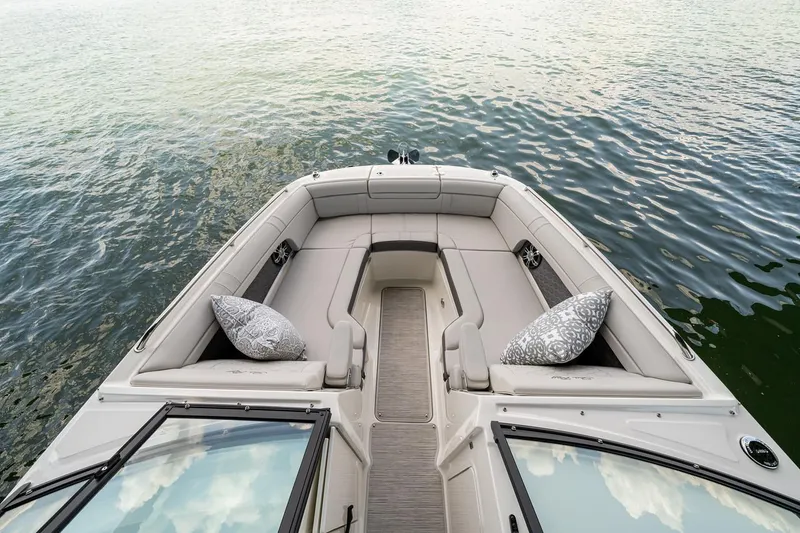 Slide: The Image of Manufacturer Provided Image: 2022 Sea Ray SDX 270 boat interior with cushioned seating and decorative pillows. - 27
