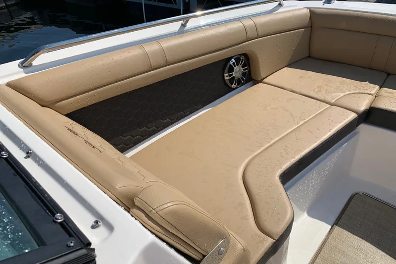 Slide: The Image of Luxurious seating on 2022 Sea Ray SDX 270 boat, featuring tan upholstery and sleek design. - 15