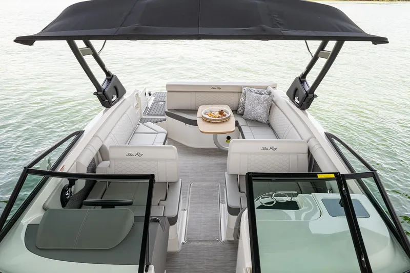 Slide: The Image of Manufacturer Provided Image: 2022 Sea Ray SDX 270 boat interior with seating and table on water. - 26