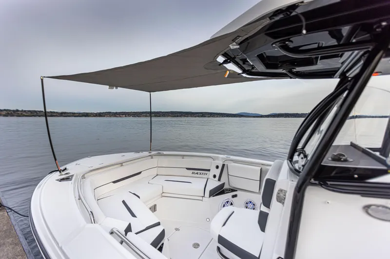 Slide: The Image of The image shows a modern boat with a sunshade canopy and stylish seating. - 10