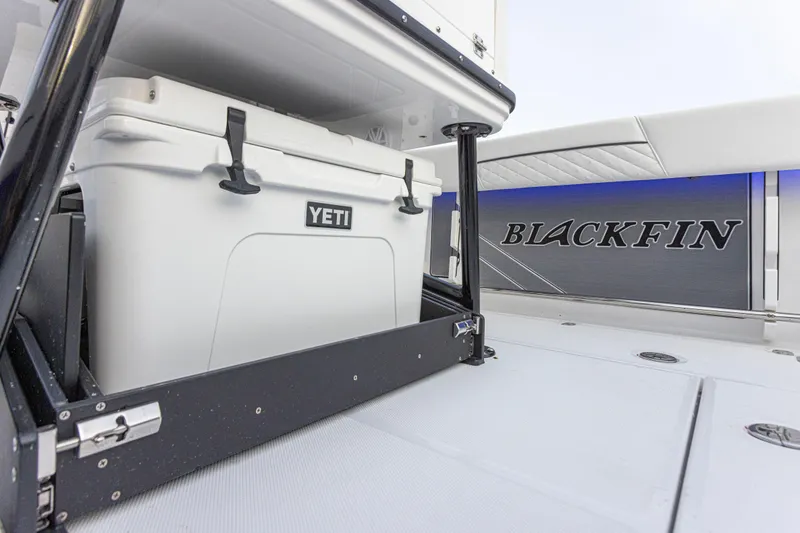 Slide: The Image of A Yeti cooler is stored in a sliding compartment on a Blackfin 252 CC boat. - 9
