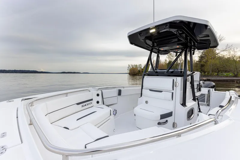 Slide: The Image of The image shows a modern Blackfin 252 CC boat from 2027 with white interior and black roof. - 20