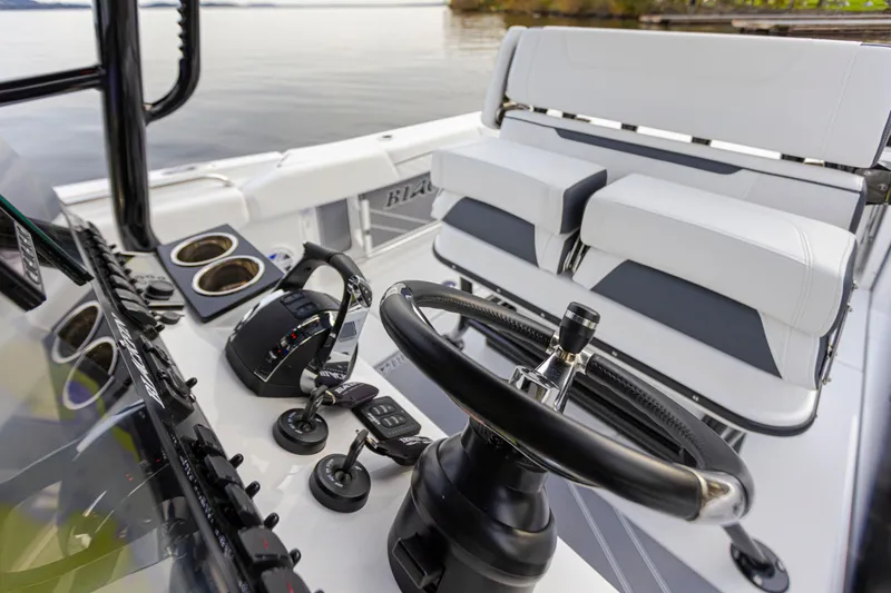 Slide: The Image of The image shows the cockpit of a Blackfin 252 CC boat with modern controls and seating. - 5