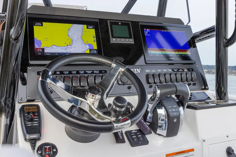 Slide: The Image of The image shows the helm of a Blackfin 252 CC boat with modern navigation systems. - 3