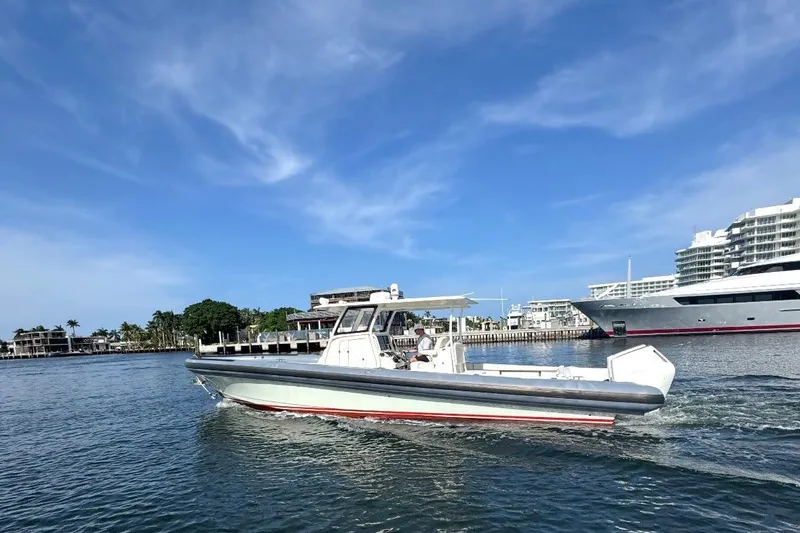Slide: The Image of 2018 Ocean 1 R boat cruising in a marina with clear blue skies. - 2