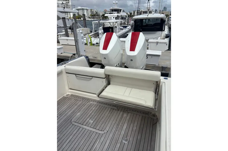 Slide: The Image of 2018 Ocean 1 R boat with dual engines, docked at marina. - 18
