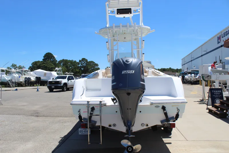 Slide: The Image of A 2019 Sportsman Open 232 Center Console boat with a 250 HP outboard motor. - 6