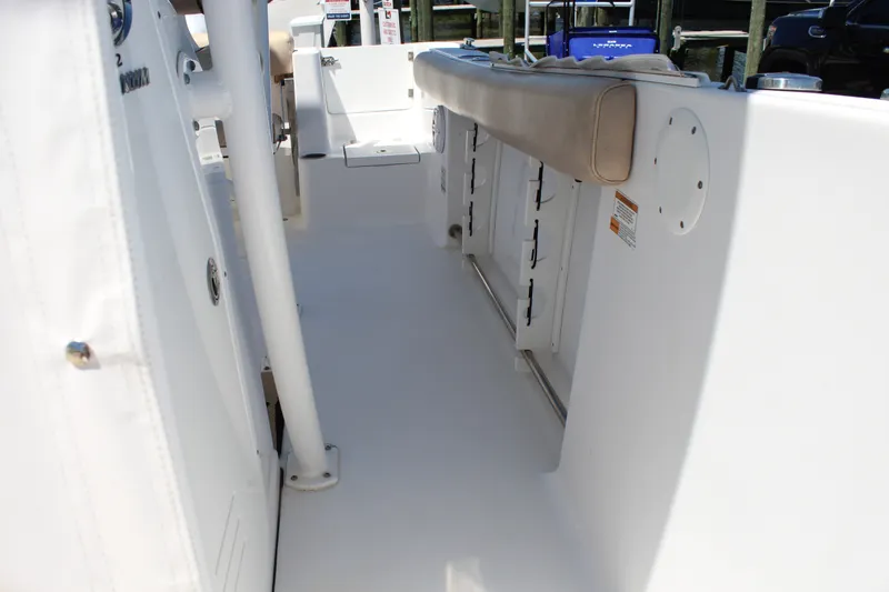 Slide: The Image of The image shows the deck of a 2019 Sportsman Open 232 Center Console boat. - 22