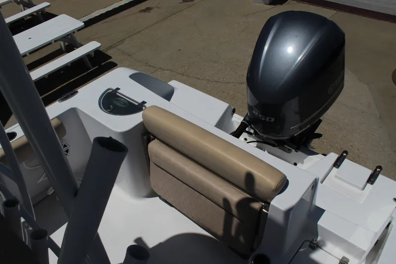 Slide: The Image of The image shows the stern of a 2019 Sportsman Open 232 Center Console boat with an outboard motor. - 12