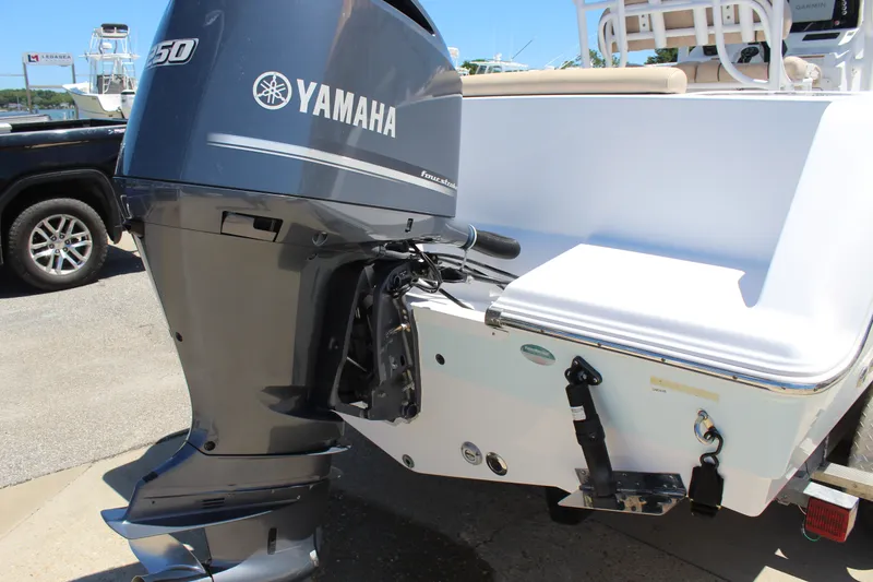 Slide: The Image of The image shows a Yamaha outboard motor on a Sportsman Open 232 Center Console boat. - 10