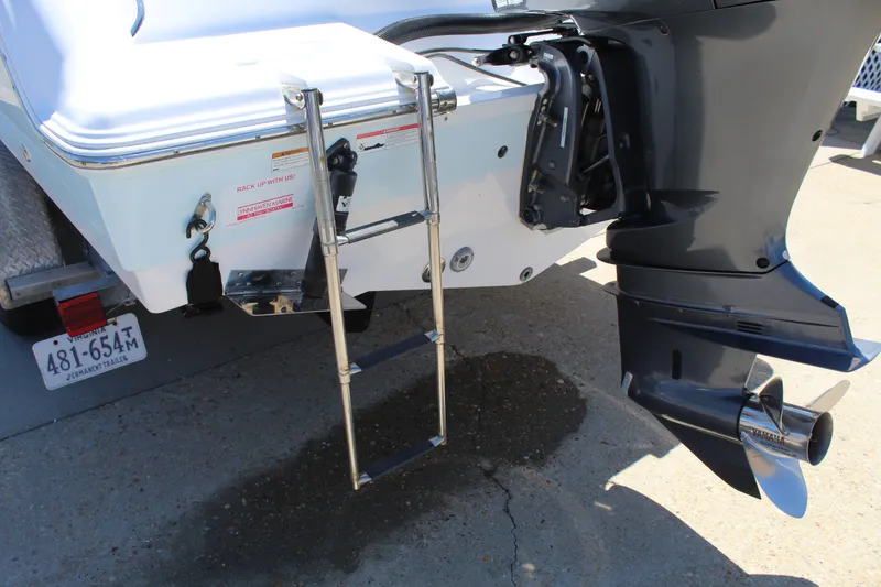 Slide: The Image of A swim ladder is mounted on the stern of a Sportsman Open 232 Center Console boat. - 9