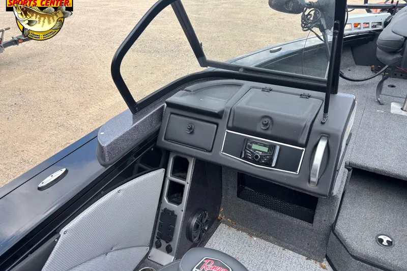 Slide: The Image of 2023 Ranger VX1788 WT boat dashboard with steering wheel and control panel. - 6