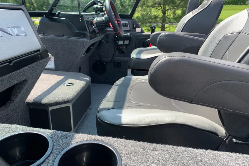 Slide: The Image of Interior of 2025 Lund 2075 Impact XS boat with comfortable seating and modern dashboard. - 19